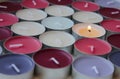 Burning candle among multicolored unlit candles Royalty Free Stock Photo