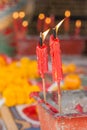 Burning candle in pot at chinese shrine. Royalty Free Stock Photo