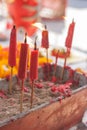 Burning candle in pot at chinese shrine. Royalty Free Stock Photo