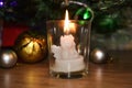 Burning candle in the shape of an angel