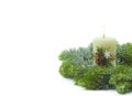 Christmas burning candle, snowy pine branches on a white background. Christmas or Winter holiday concept. Isolated