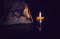 Burning candle and the Star of David