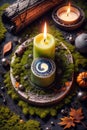 burning candle, symbol of the moon, amulet lying on moss on a dark natural background. pagan Wicca, Slavic traditions. Witchcraft