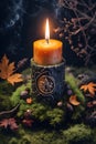 burning candle, symbol of the moon, amulet lying on moss on a dark natural background. pagan Wicca, Slavic traditions. Witchcraft