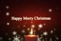 Burning candle and text of Happy Merry Christmas Royalty Free Stock Photo