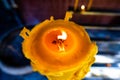 Burning candle in Thai temple Royalty Free Stock Photo