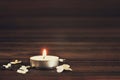 Burning candle and white flowers Royalty Free Stock Photo