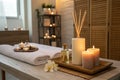 Burning candles and aromatic reed diffuser in spa Royalty Free Stock Photo
