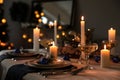 Burning candles on beautiful  table setting for Christmas dinner Royalty Free Stock Photo