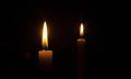 Burning candles on a black background Royalty Free Stock Photo
