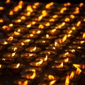 Burning candles in Buddhist temple, India