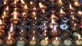 Burning candles in Buddhist temple, Katmandu