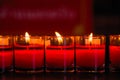 Burning candles at a Buddhist temple,Lighting of Praying candles Royalty Free Stock Photo