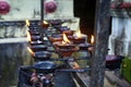 Burning candles in Buddhist temple in Sri Lanka. Royalty Free Stock Photo