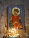 Burning candles and Christian Orthodox icon inside Svetitskhoveli Cathedral, Mtskheta, Georgia.