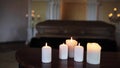 Burning candles and coffin in church at funeral