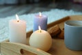 Burning candles and cup of coffee Royalty Free Stock Photo