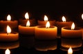 Burning candles in the dark night for a concept Royalty Free Stock Photo