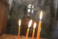 Burning candles in a dark Orthodox church. Rhodes. Greece Royalty Free Stock Photo