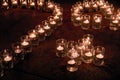 Burning candles in glass flasks stand on the floor of celebraiotn hall. Royalty Free Stock Photo