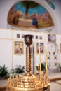 Burning candles in a golden candlestick. Church of Saint Panteleimon the Healer, Khmelnitsky, Ukraine - 27 november 2021