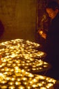 Burning candles inside the Notre Dame Cathedral, Paris, France