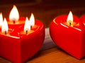 A burning heart-shaped red candles. Generative AI