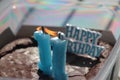 Burning candles number 1 makes 11 in a cake  for a birthday in blue color. Royalty Free Stock Photo