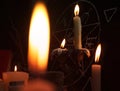 Burning candles and pentagram symbol