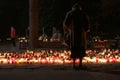 Burning candles and people visit graves in The Old Cemetery in Lodz, Poland on All Saints Day in Poland Royalty Free Stock Photo