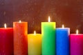 Burning Candles In Rainbow Colors Royalty Free Stock Photo