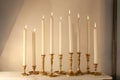 Burning candles in retro candlesticks indoor Royalty Free Stock Photo
