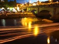 Blurred burning candles on river at festival in German spa town Bad Kissingen Royalty Free Stock Photo