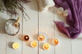 Burning candles and set for spa with heather on a white wooden table, top view Royalty Free Stock Photo