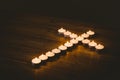 Burning candles in shape of cross Royalty Free Stock Photo