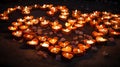 Burning candles in the shape of a heart on a dark background Generative AI