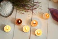 Burning candles and spa set with heather and bath salt on a wooden table Royalty Free Stock Photo