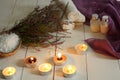 Burning candles and spa set with heather on a wooden table Royalty Free Stock Photo