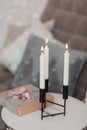 Burning candles stand in the New Year`s hall on the table Royalty Free Stock Photo