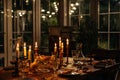 Burning candles on the table in a cozy house in the evening decorate the table with food.