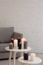 Burning candles on tables Royalty Free Stock Photo