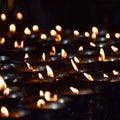 Burning candles in Tibetan Buddhist temple. Himachal Pradesh, India, Buddhist floating colorful Candle floating on water for pray