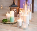 Burning candles in transparent glass vases