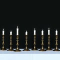 Burning candles in a vintage golden candlesticks. 3d render