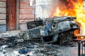 Burning car. car destroyed and set on fire during the riots. city center Royalty Free Stock Photo