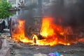 Burning car in the center of city during unrest