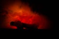 Burning car on a dark background. Car catching fire, after act of vandalism or road indicent Royalty Free Stock Photo
