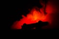 Burning car on a dark background. Car catching fire, after act of vandalism or road indicent Royalty Free Stock Photo