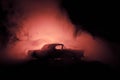 Burning car on a dark background. Car catching fire, after act of vandalism or road indicent Royalty Free Stock Photo