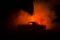 Burning car on a dark background. Car catching fire, after act of vandalism or road indicent Royalty Free Stock Photo